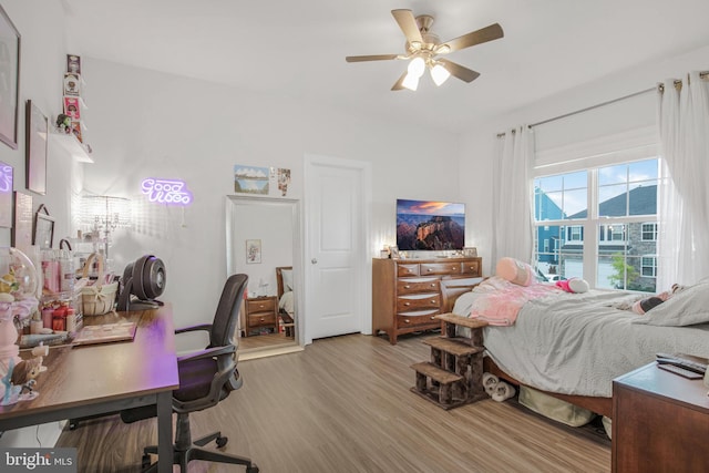 bedroom featuring ceiling fan and light wood-type flooring