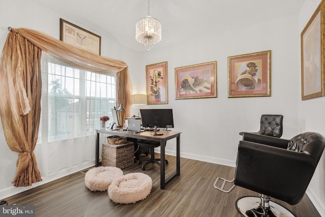 office space featuring an inviting chandelier and dark hardwood / wood-style flooring