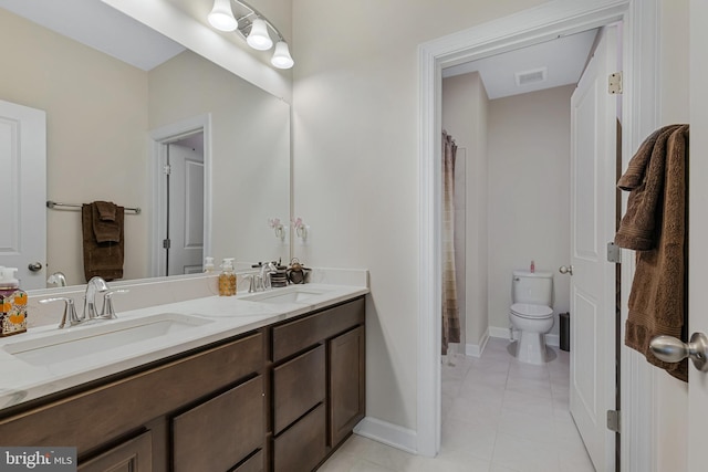 bathroom with vanity, a shower with shower curtain, toilet, and tile patterned floors