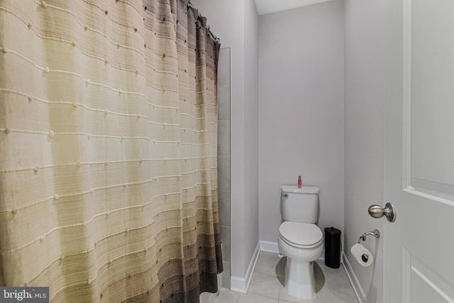 bathroom featuring toilet, walk in shower, and tile patterned flooring