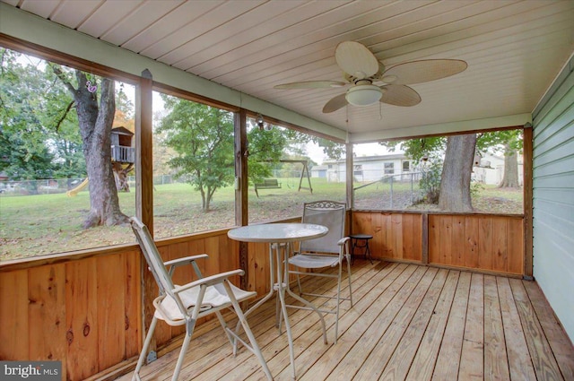 sunroom with plenty of natural light and ceiling fan