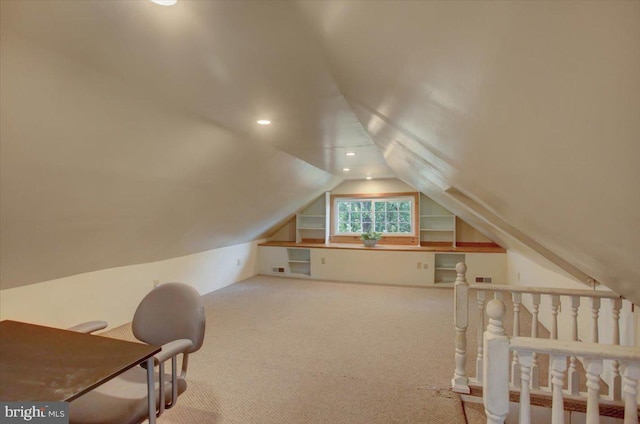 bonus room with carpet floors and vaulted ceiling