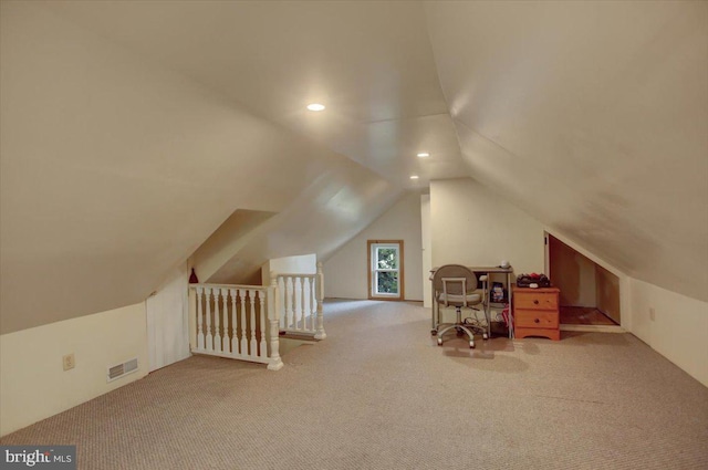 bonus room featuring lofted ceiling and light carpet