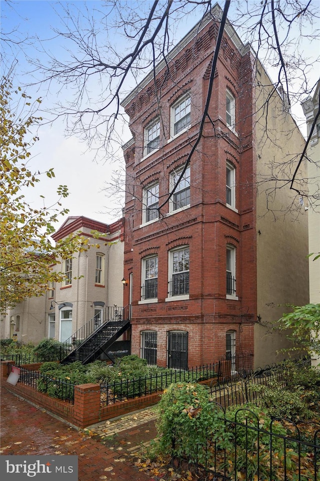 651 Constitution Ave NE, Washington, DC 20002 - view of home's exterior featuring brick siding and a fenced front yard