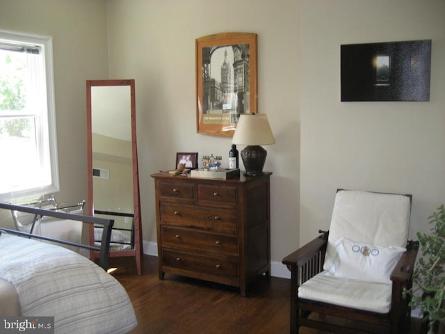 bedroom featuring dark hardwood / wood-style flooring