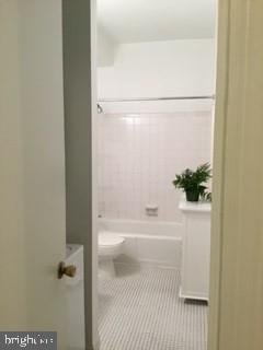 bathroom featuring tile patterned floors and toilet