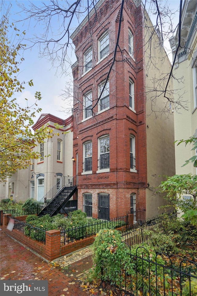 651 Constitution Ave NE, Washington, DC 20002 - exterior space featuring a fenced front yard and brick siding