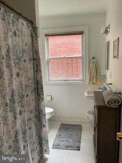 bathroom with vanity, tile patterned flooring, toilet, and a shower with shower curtain