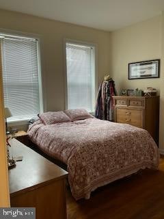 bedroom with hardwood / wood-style flooring