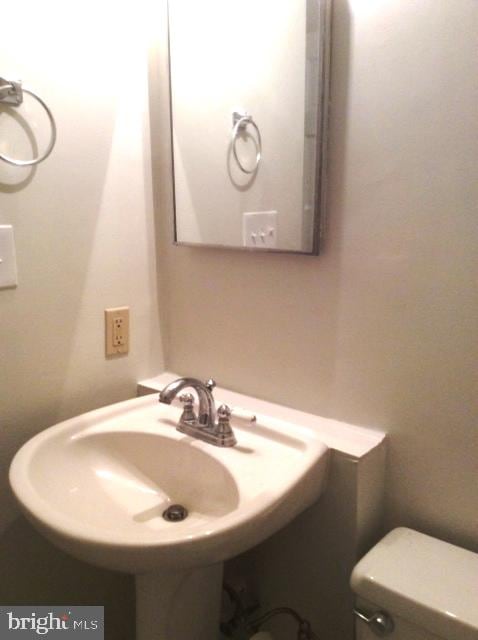 bathroom with toilet and sink