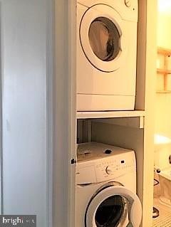 laundry room featuring stacked washer and dryer