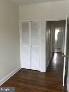 corridor featuring dark hardwood / wood-style floors