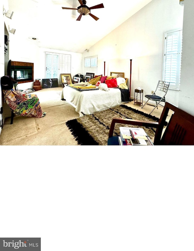 bedroom with lofted ceiling, carpet, and a ceiling fan