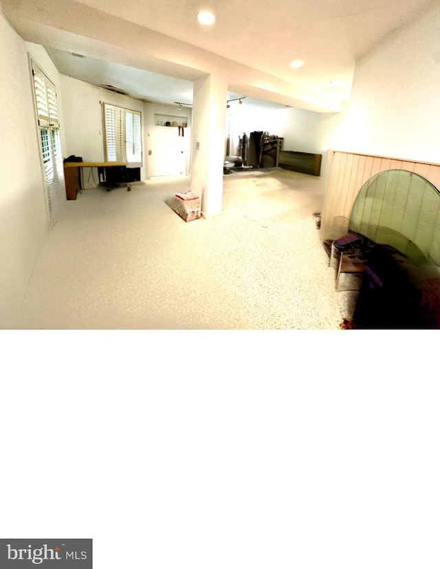 interior space featuring recessed lighting and carpet