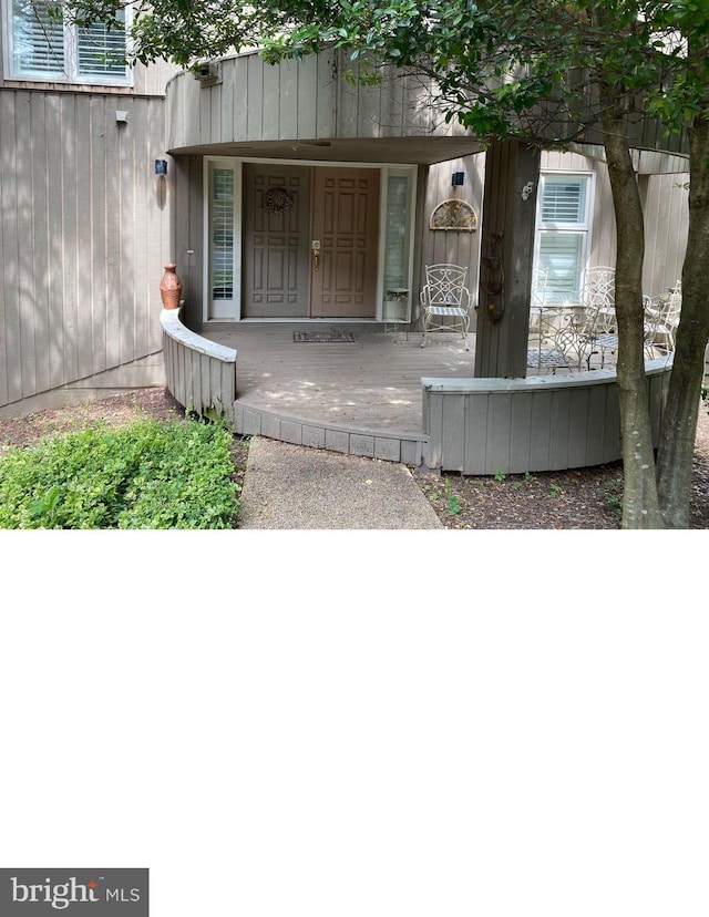 doorway to property featuring a porch