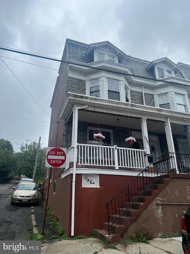 view of front of home featuring covered porch