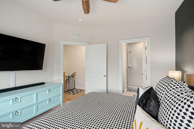 bedroom with ceiling fan, light hardwood / wood-style flooring, and ensuite bath