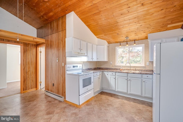 kitchen featuring baseboard heating, wooden walls, sink, white cabinetry, and white appliances