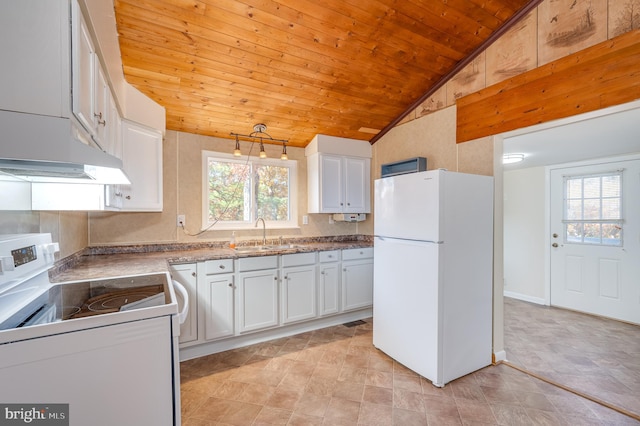 kitchen with lofted ceiling, white cabinetry, plenty of natural light, and white appliances