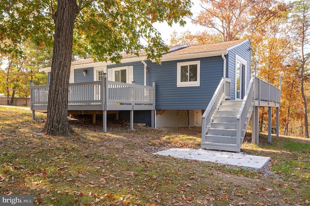 back of property featuring a deck