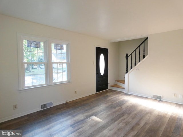 entrance foyer with dark hardwood / wood-style floors