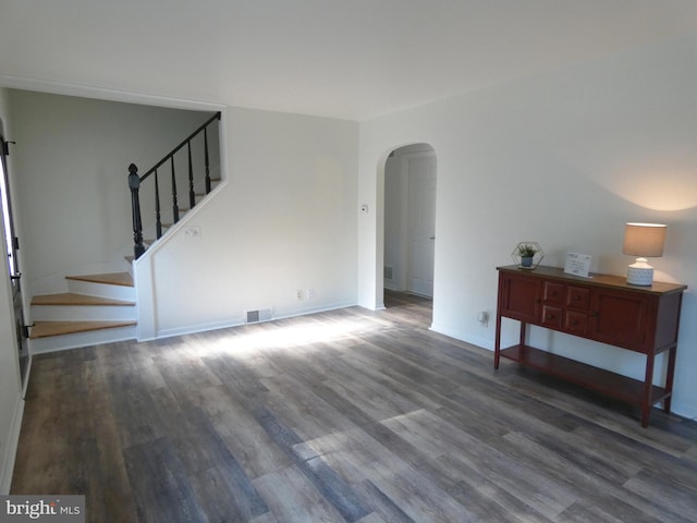 living room with dark hardwood / wood-style flooring