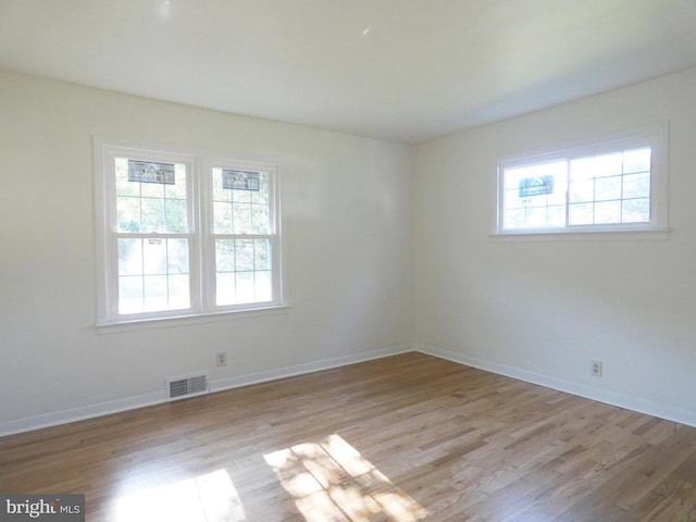 spare room featuring light wood-type flooring