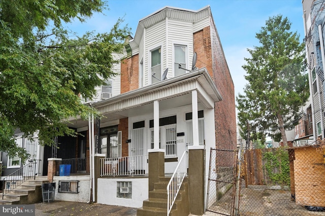 view of property featuring a porch