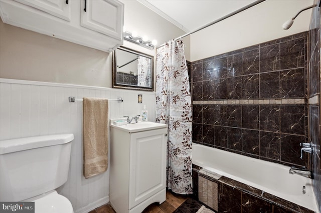 full bathroom with vanity, crown molding, hardwood / wood-style flooring, shower / tub combo with curtain, and toilet