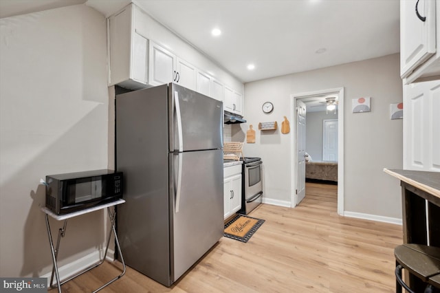 kitchen featuring light hardwood / wood-style flooring, white cabinets, ceiling fan, and appliances with stainless steel finishes