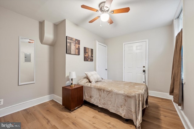 bedroom with ceiling fan and light hardwood / wood-style flooring