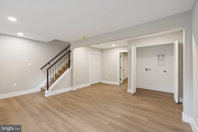 unfurnished living room featuring light wood-type flooring