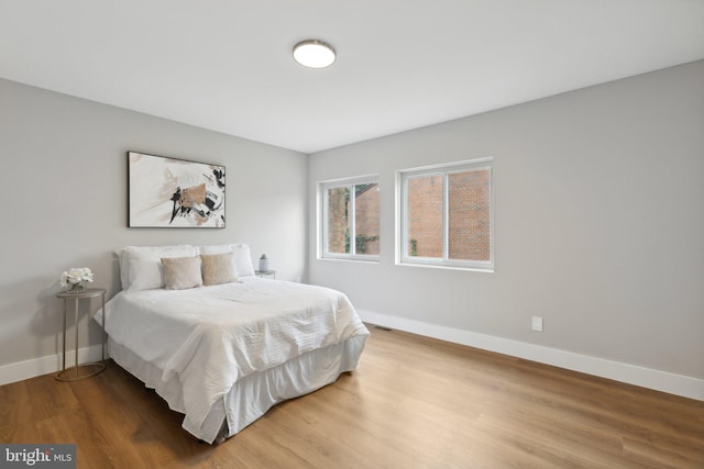 bedroom with wood-type flooring