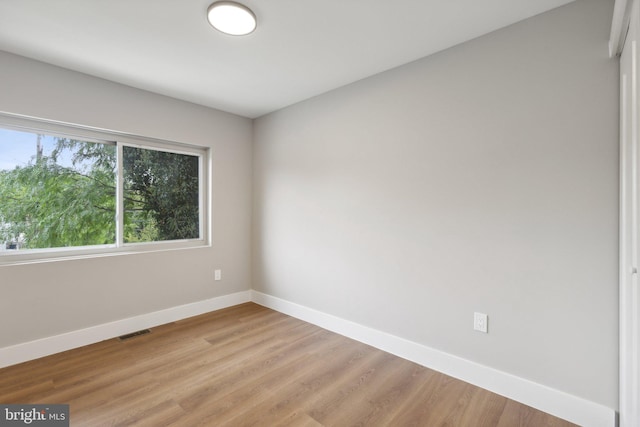 unfurnished room with light hardwood / wood-style flooring