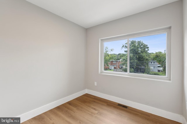 unfurnished room featuring light hardwood / wood-style floors