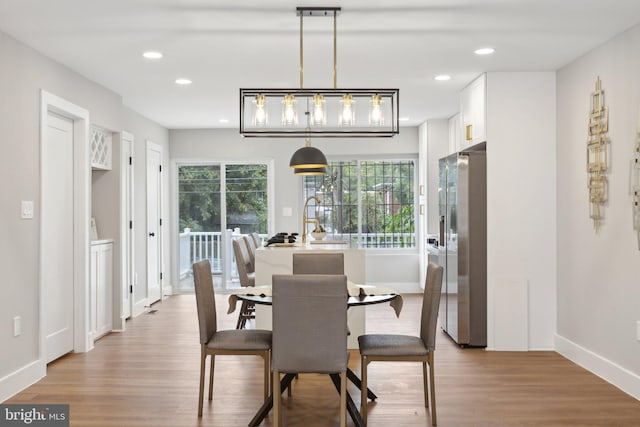 dining space with light wood-type flooring