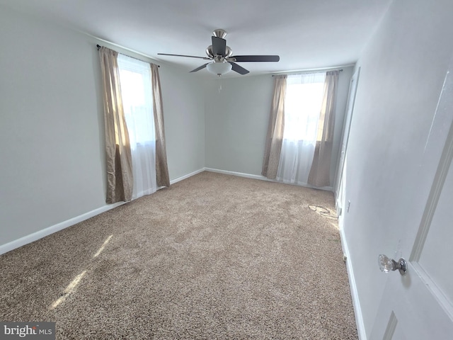 unfurnished room featuring carpet flooring and ceiling fan