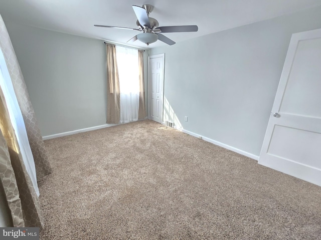 carpeted empty room with ceiling fan