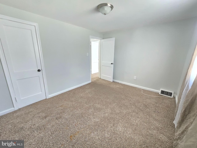 unfurnished bedroom with carpet floors