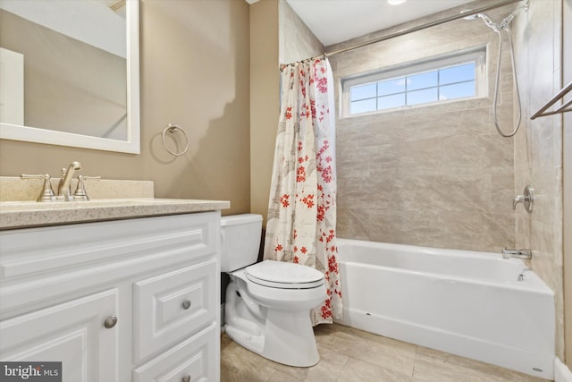 full bathroom featuring toilet, vanity, tile patterned floors, and shower / bath combo with shower curtain