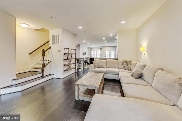 living room featuring dark hardwood / wood-style floors and a baseboard radiator