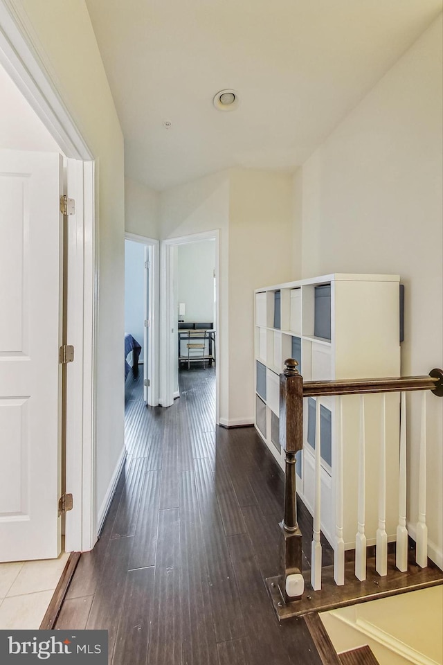 hall featuring dark wood-type flooring