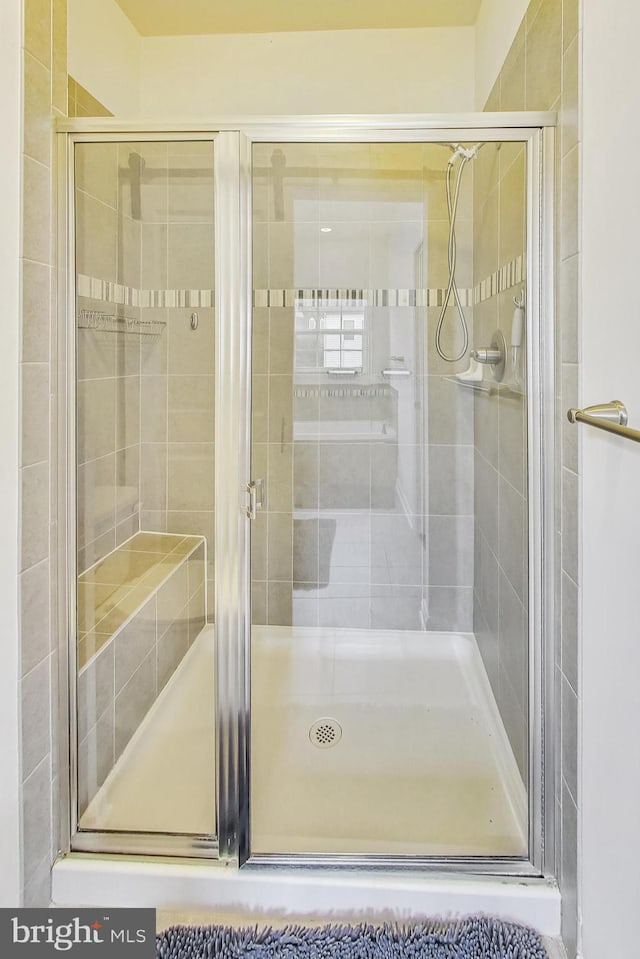 bathroom featuring an enclosed shower