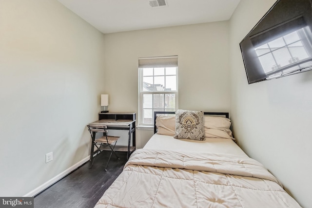 bedroom featuring dark wood-type flooring