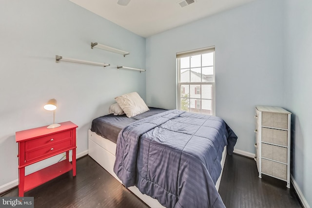 bedroom featuring ceiling fan and dark hardwood / wood-style flooring