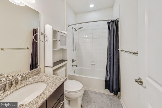 full bathroom with shower / bath combo, vanity, and toilet