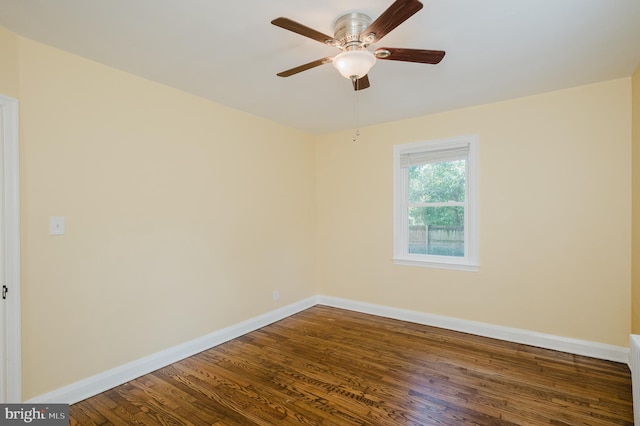 spare room with ceiling fan and hardwood / wood-style flooring