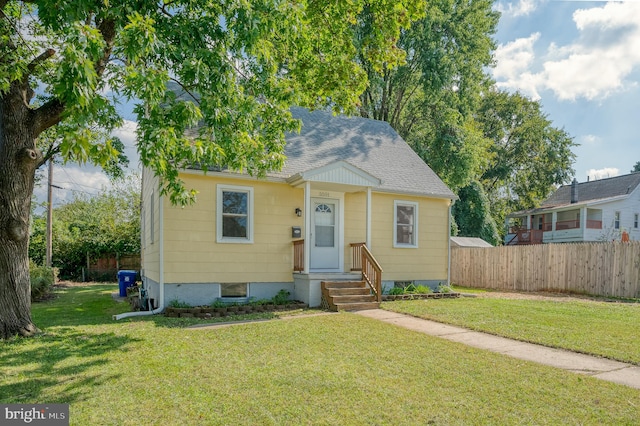 bungalow with a front lawn