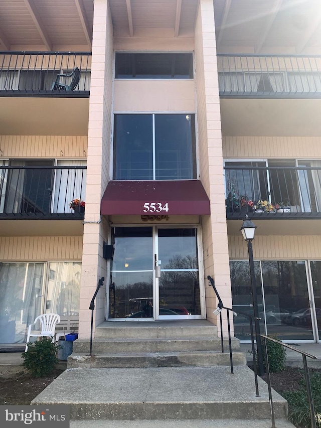 property entrance with a balcony