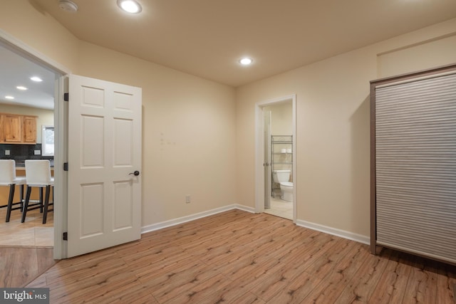 bedroom with light wood-type flooring